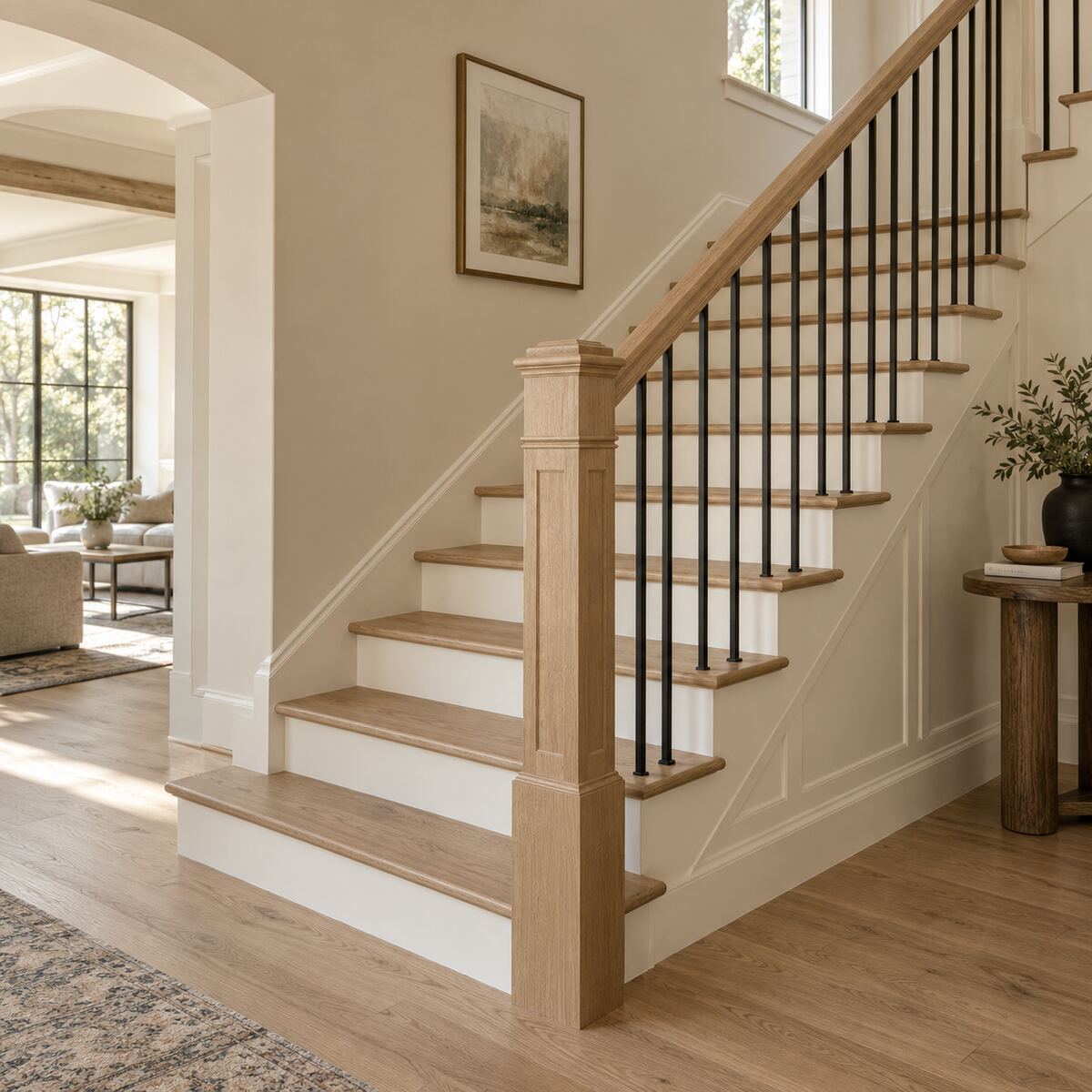 Completed white oak staircase with custom newel and aligned balusters